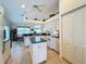 Open kitchen with island, white appliances and green countertops at 252 Medalist Rd, Rotonda West, FL 33947