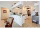 Kitchen features light cabinets, granite counters, and breakfast bar at 252 Medalist Rd, Rotonda West, FL 33947