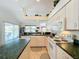 Kitchen with island, white appliances & green countertops at 252 Medalist Rd, Rotonda West, FL 33947