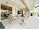 Dine alfresco overlooking the pool and lush greenery at 252 Medalist Rd, Rotonda West, FL 33947