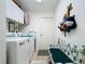 Laundry room with washer, dryer, and storage at 252 Medalist Rd, Rotonda West, FL 33947