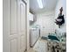 Laundry room with washer, dryer, and built-in storage at 252 Medalist Rd, Rotonda West, FL 33947
