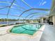 Enjoy this relaxing pool area with water views at 252 Medalist Rd, Rotonda West, FL 33947