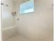 Clean shower with built-in seat and window at 252 Medalist Rd, Rotonda West, FL 33947