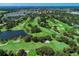 Aerial view of a golf course community at 26906 Weiskopf Dr, Englewood, FL 34223