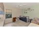 Bedroom with a daybed, desk, and light green walls at 26906 Weiskopf Dr, Englewood, FL 34223