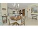 Casual dining area with round table and chairs next to kitchen at 26906 Weiskopf Dr, Englewood, FL 34223