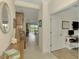Entryway with view into the living room and office at 26906 Weiskopf Dr, Englewood, FL 34223