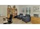 Home office with built-in shelves and comfortable seating at 26906 Weiskopf Dr, Englewood, FL 34223