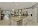 Modern kitchen with granite island and stainless steel appliances at 26906 Weiskopf Dr, Englewood, FL 34223