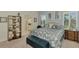 Main bedroom with king-size bed and ensuite bathroom at 26906 Weiskopf Dr, Englewood, FL 34223