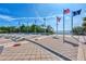 Flag monument overlooking the water with several flags at 26906 Weiskopf Dr, Englewood, FL 34223