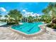 Community pool with lap lanes, lounge chairs, and a clubhouse at 26906 Weiskopf Dr, Englewood, FL 34223
