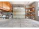 Spacious garage with ample storage shelving and large overhead door at 2805 N Beach Rd # B, Englewood, FL 34223