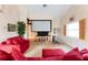 Home theater with projector, screen, and comfortable seating at 2805 N Beach Rd # B, Englewood, FL 34223