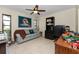 Home office with built-in desk and access to backyard at 307 Gladstone Blvd, Englewood, FL 34223