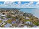 Wide aerial view of residential area near the water at 321 S Mango St, Englewood, FL 34223