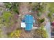 Aerial view of the house, showing its blue roof at 321 S Mango St, Englewood, FL 34223