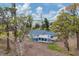 Aerial view of the house and surrounding trees at 321 S Mango St, Englewood, FL 34223