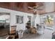 Enclosed porch with access to kitchen and backyard at 321 S Mango St, Englewood, FL 34223