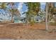 Small, single story house with overgrown yard at 321 S Mango St, Englewood, FL 34223