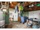 Overcluttered garage with storage and laundry hookups at 321 S Mango St, Englewood, FL 34223