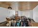Living Room with wood ceiling and needs renovation at 321 S Mango St, Englewood, FL 34223