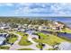 Aerial view of waterfront community with canals and private docks on a sunny day at 3522 Fox Ter, Port Charlotte, FL 33981