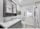 Bright bathroom features modern vanity, mirrored cabinet, and a walk-in shower at 3522 Fox Ter, Port Charlotte, FL 33981