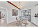 Dining area with a glass table and chairs next to sliding glass doors to the patio at 3522 Fox Ter, Port Charlotte, FL 33981