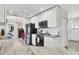 Well-lit kitchen features white cabinets, gray countertops, and modern stainless steel appliances at 3522 Fox Ter, Port Charlotte, FL 33981