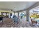 Covered patio features chairs and table with a view of the pool at 3522 Fox Ter, Port Charlotte, FL 33981