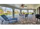 Spacious screened patio with seating area overlooking the pool and lake view at 3522 Fox Ter, Port Charlotte, FL 33981