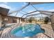 Inviting pool area with screened enclosure and spacious patio at 4204 Cockrell St, Port Charlotte, FL 33948