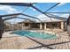Inviting kidney-shaped pool with a screened enclosure at 4204 Cockrell St, Port Charlotte, FL 33948