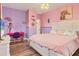 Pink bedroom with king-size bed and built-in desk at 4220 Cape Haze Dr, Placida, FL 33946