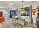 Kitchen dining area with farmhouse table and seating for four at 4220 Cape Haze Dr, Placida, FL 33946