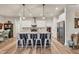 Modern kitchen with island, stainless steel appliances, and white cabinets at 4220 Cape Haze Dr, Placida, FL 33946