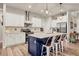 Spacious kitchen boasts a large island, white cabinetry, and stainless steel appliances at 4220 Cape Haze Dr, Placida, FL 33946