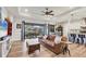 Open concept living area with leather sofas and views to the backyard at 4220 Cape Haze Dr, Placida, FL 33946