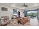 Spacious living room with leather couch and access to a patio at 4220 Cape Haze Dr, Placida, FL 33946