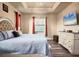 Spacious main bedroom with king bed, dresser, and large windows at 4220 Cape Haze Dr, Placida, FL 33946