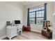 Home office with window, white desk, and cat tree at 4220 Cape Haze Dr, Placida, FL 33946