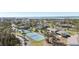 Aerial view of community with tennis courts and water views at 4260 Placida Rd # 18C, Englewood, FL 34224