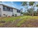 Landscaped backyard with building exterior at 4260 Placida Rd # 18C, Englewood, FL 34224