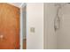 Bathroom with shower stall and wood door at 4260 Placida Rd # 18C, Englewood, FL 34224