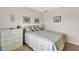 Cozy bedroom with dresser and bedding at 4260 Placida Rd # 18C, Englewood, FL 34224