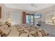 Bedroom with king bed, balcony access, and ceiling fan at 4260 Placida Rd # 18C, Englewood, FL 34224