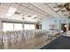 Community room with rows of chairs and tables at 4260 Placida Rd # 18C, Englewood, FL 34224