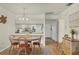Dining area with table, chairs, and kitchen view at 4260 Placida Rd # 18C, Englewood, FL 34224